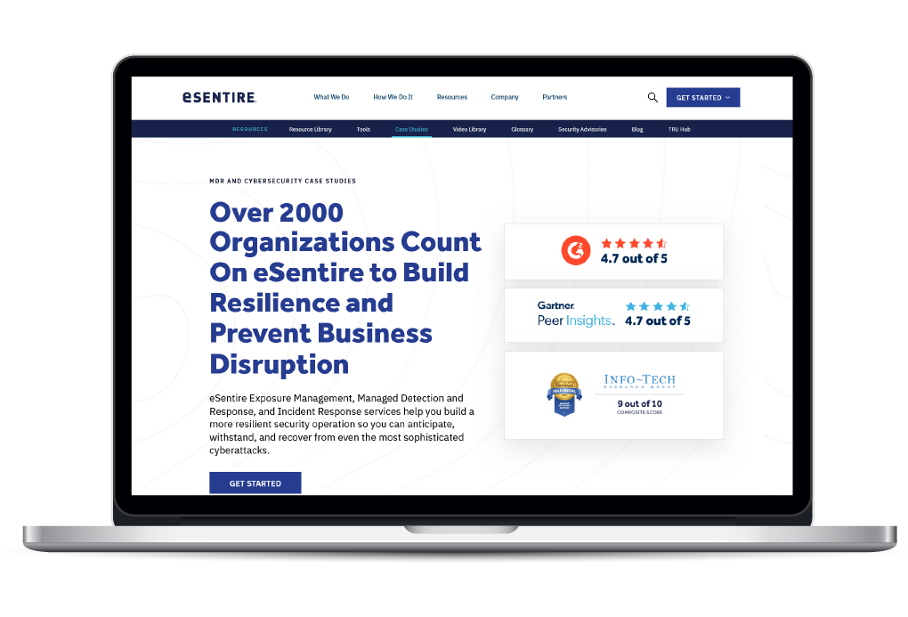 Laptop with the Case Studies page from eSentire.com that I worked on